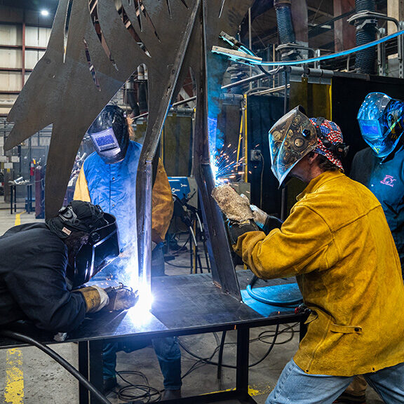 Students weld the supports onto a 12-foot tall metal sculpture that will be displayed at Camp Hall during class Thursday, Dc. 1, 2022 at Trident Technical College. Paul Zoeller/Santee Cooper