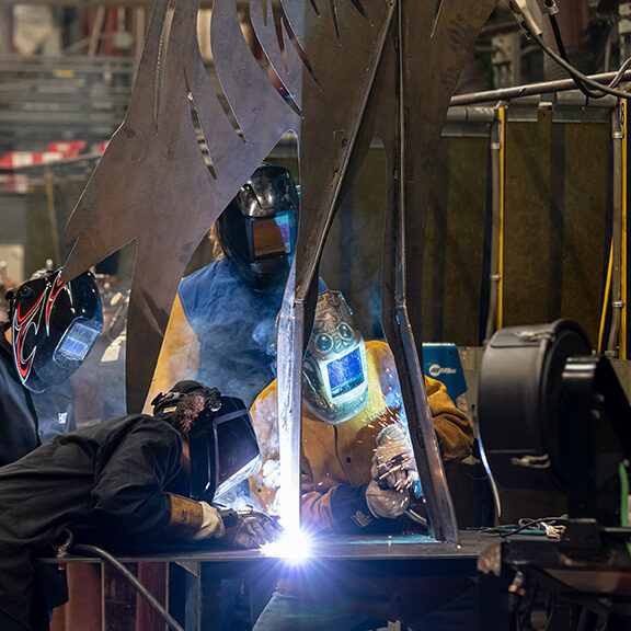 Students weld the supports onto a 12-foot tall metal sculpture that will be displayed at Camp Hall during class Thursday, Dc. 1, 2022 at Trident Technical College. Paul Zoeller/Santee Cooper