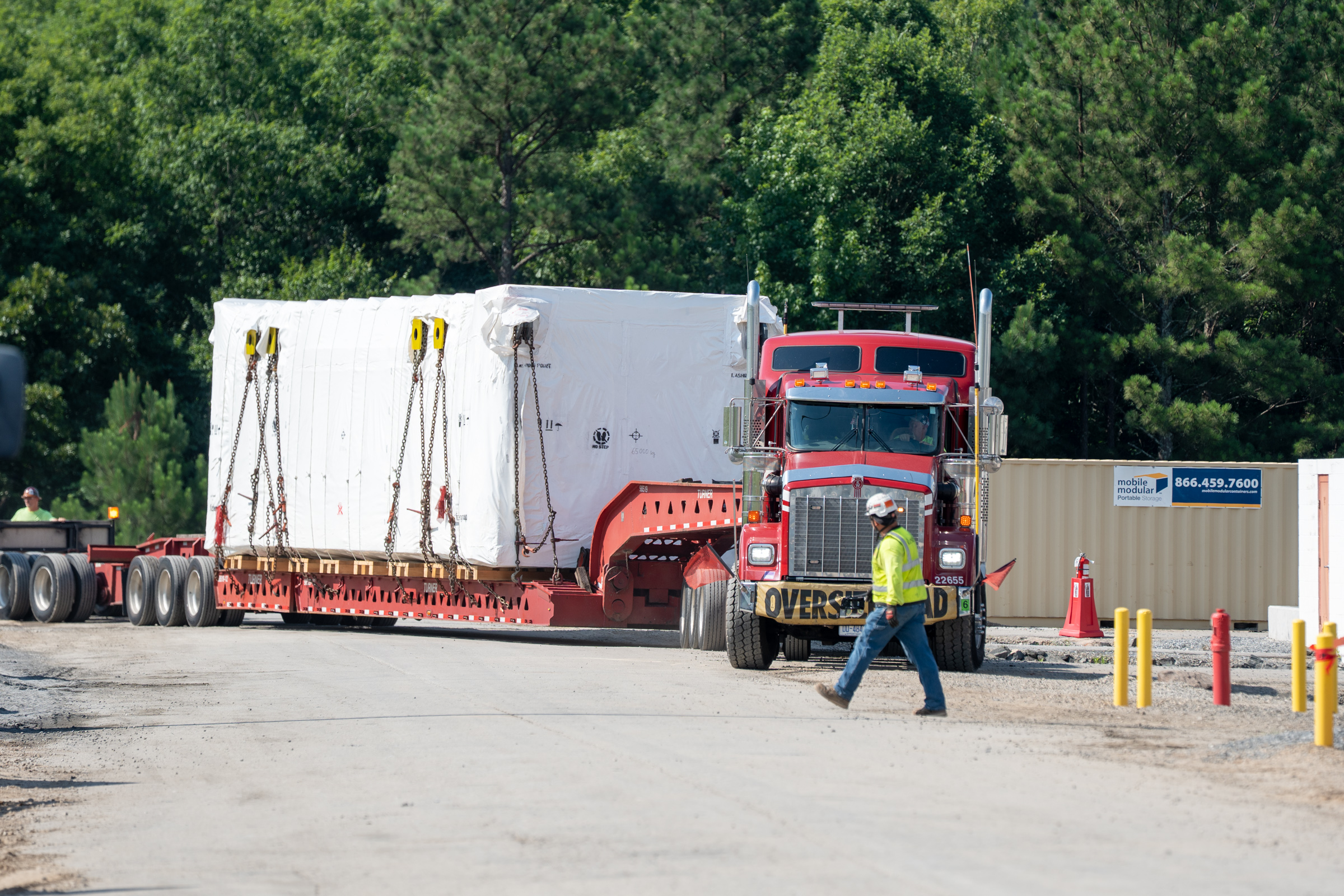 steam surface condenser arriving on flatbed truck