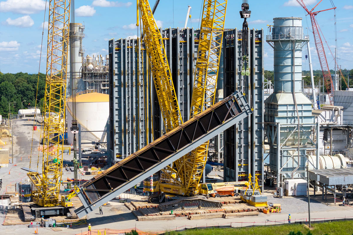 cranes raise HRSG component into place